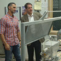 <p>Peter Tucci of Tucci Lumber Co. in Norwalk gives U.S. Rep. Jim Himes a tour of the facility where he makes 16,000 baseball bats per year.</p>