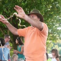 <p>It&#x27;s not a snake, it&#x27;s an apple peel made by an old-fashioned apple peeler. Jared Silbersher, of Pound Ridge, N.Y., was giving demonstrations of apple peeling and apple slicing using pre-electric technology at Ambler Farm&#x27;s fall festival Sunday.</p>