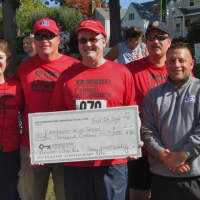 <p>The Eastchester Irish American Social Club presents $10,000 raised for Eastchester High School 
at the inaugural Eastchester 5K Race on Sunday, Sept. 28.</p>