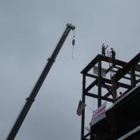 <p>Steelworkers stand atop the White Plains Hospital beams, 75 feet above ground, in September 2014. On Monday, White Plains Hospital administrators and staff joined Mayor Tom Roach in celebrating the opening of three new floors which they toured.</p>