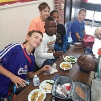 <p>Pocantico Schools students enjoy soup they made from their own harvest of vegetables.</p>