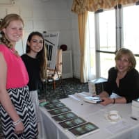 <p>From left, Elizabeth Regan and Emma Luis, students from Hommocks Middle School, participated in the Rally for Reading luncheon in April to raise funds for &quot;bricks&quot; for school library in Sri Lanka, with author Christina Baker Kline.</p>