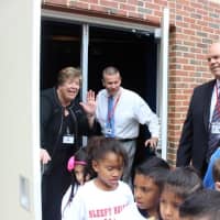 <p>Sleepy Hollow High School Principal Carol Conklin-Spillane, left, and W.L. Morse School Principal Tom Holland, right, joined in the 24th Annual Rose Ceremony between the high school seniors Class of 2015 and first graders (Class of 2026).
</p>