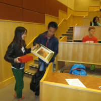 <p>Shanghai Experimental School students describe gifts they brought to MHS from China, including a calendar and artwork.</p>