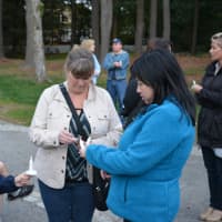<p>Three neighbors of Armonk&#x27;s Applebaum family gather at a vigil. Pictured from left to right are Elizabeth Parisi, Carol Ann Parisi and Linh Pham.</p>