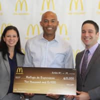 <p>Jessica Mato, and Josh Kaufman presenting the $10,000 donation on behalf of McDonalds New York Metro Owner/Operators Association to New Rochelle&#x27;s Mariano Rivera.</p>