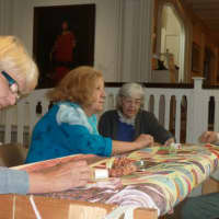 <p>Women work on a quilt at the Stamford Museum &amp; Nature Center that will be used as a fundraiser for the museum. From left are: Doris Ieva, Pia DeLuca, Laura Lovello and Sonhild Rodney.</p>