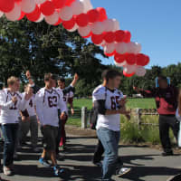 <p>Harrison High School football players raised more than $3,100 for American Heart Association during Sunday&#x27;s walk at Kensico Dam, Valhalla. </p>