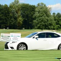 <p>A golfer tees off on the hole-in-one contest sponsored by Lexus of Greenwich.</p>