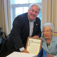 <p>Tuckahoe Mayor Steve Ecklond issuing a proclamation to Emily Viola.</p>