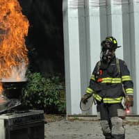 <p>A Scarsdale firefighter demonstrating at a previous fire fair.</p>