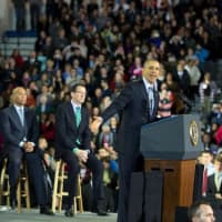 <p>President Barack Obama, on stage with Gov. Dannel Malloy, speaks about the minimum wage at Central Connecticut State University. </p>