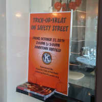 <p>A flier hangs in the Quattro Pazzi Cafe at 1599 Post Road letting trick-or-treaters know they are welcome.</p>