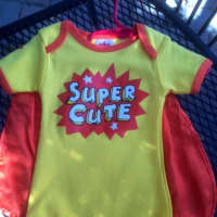 <p>Baby can be a superhero in this caped outfit, available at Sunshine &amp; Clover in Croton-on-Hudson.</p>