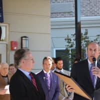 <p>Deputy County Executive Kevin Plunkett (right) hold a proclamation at The Bristal at Armonk&#x27;s grand opening. Pictured to the left is County Legislator Michael Smith.</p>