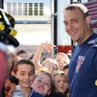 <p>Students visit the fire department and meet the firefighters. </p>
