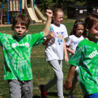 <p>Third-graders Will Sonnenblick and Aven Mallie show off their school spirit wear, with Sarah Donnelly, Brooke Bodick and Chloe Leimgruber in the background.</p>