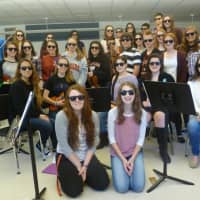 <p>Orchestra students pose in their sunglasses in honor of World Vision Day. </p>