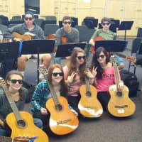<p>Guitar students sport their sunglasses in honor of World Vision Day.</p>