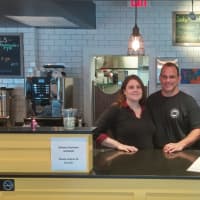 <p>Owners Jessica and Josh Tolk stand behind the counter of their newly acquired restaurant on Weston Avenue.</p>