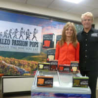 <p>Kim and Marty Sands stand with their Paleo Passion Pops brand, an all-natural frozen dessert. The Greenwich-based Paleo Passion Foods company is selling the popsicles in Fairfield and Westchester counties and Manhattan.</p>