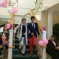 <p>Darien High School students served as escorts for Atria Darien Assisted Living residents at the Oct. 14 Pretty in Pink fundraiser.</p>