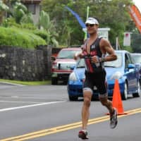 <p>Easton&#x27;s Chris Thomas runs during the Ironman World Championships in Hawaii. </p>
