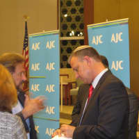 <p>Israeli parliament&#x27;s Erel Margalit meets with Harrison audience members after his talk Oct. 7.</p>