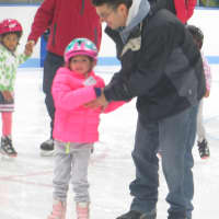 <p>Harper Totorella, 3, of Mamaroneck with her father, Christopher, a 1998 graduate of Mamaroneck High School. He traveled to states, twice, with the MHS hockey team. </p>