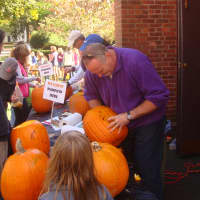 <p>Volunteers carve the designs into the pumpkins using jigsaws and other tools.</p>