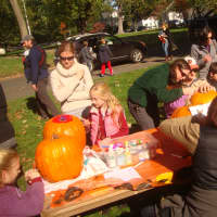 <p>Fairfield families design their pumpkins before carving at the fifth annual Pumpkin Carving Event on St. Paul&#x27;s Green.</p>