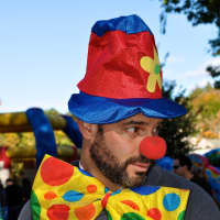 <p>A local resident dresses up as a clown. </p>