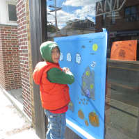 <p>Luca Reali, a second-grader at Harrison Avenue School, puts some finishing touches on his painting at Mamma Sophia&#x27;s Pizza Restaurant. </p>