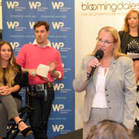 <p>Una Hopkins, administrative director of the WPH Cancer Program, speaks to the crowd at the Cancer Survivor and Caregiver fashion show to benefit White Plains Hospital.</p>