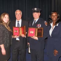 <p>Liberty Mutual representatives Sales Representative Kathryn Ilardi, le and Senior Branch Manager Genet Hardesty presented the Liberty Mutual Fire Mark Award to Chief Lou DiMeglio for the New Rochelle Fire Department and Firefighter Daniel Thompson.</p>