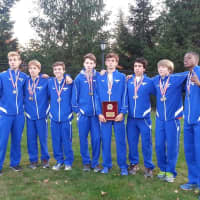 <p>Danbury High School&#x27;s boys cross country team shows its FCIAC championship trophy.</p>