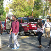 <p>Rye High students walk back to class, crossing Milton Road, after temporarily going to Midland Elementary School.</p>