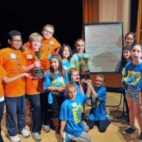 <p>The Bronxville Bright Broncos celebrating their victory with the Ossining Public Library squad, which won the teen division. </p>