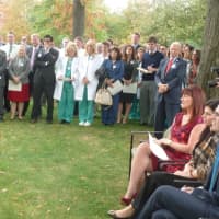 <p>Hospital staff, family, community members and public officials gather to honor departing Greenwich Hospital CEO and President Frank Corvino, standing at right in red tie. Corvino is retiring at the end of the year after 23 years its chief.</p>