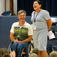 <p>Chris Waddell, a former competitive skier at Middlebury College who is now paralyzed from the waist down from an accident on the slopes, presents to Katonah Elementary School.</p>