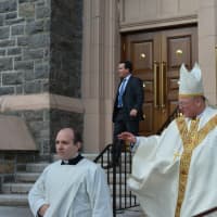 <p>Cardinal Timothy Dolan exits from the Church of Saint Francis of Assisi in Mount Kisco before the Monsignor Daniel Flynn&#x27;s casket is  brought outside.</p>