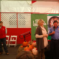 <p>Stew Leonard, Jr., introduces Martha Stewart to a crowd of waiting customers on Saturday, Oct. 25.</p>
