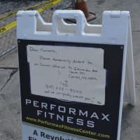 <p>Signage at Performax Fitness gives the address to a sister location in Carmel.</p>
