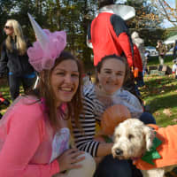 <p>Left to right: Kayla Smith, a YMCA Youth Program Director; Bonnie Fogarty, Executive Director of the local YMCA; and Cooper, a dog dressed as a pumpkin.</p>