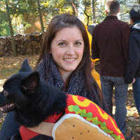 <p>Somers resident Michelle Chiappa with her dog Frank, who is dressed as a hotdog. Frank, who is a rescue dog, won Coolest Canine Costume in a contest.</p>