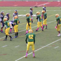 <p>The Norwalk Packers 7th grade football team gets ready to tackle Bridgeport on Saturday. </p>