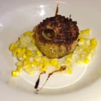 <p>A mini version of Cedar Street Grill&#x27;s crab cake over creamed corn </p>