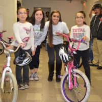 <p>Rye teens assist with collecting 130 bikes for children in New Rochelle. </p>