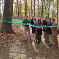 <p>Officials gather to cut the ribbon for the new trail. </p>