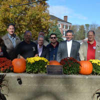 <p>Community members pose for pictures behind the Somers water trough, which was dedicated on Sunday at Bailey Park.</p>
